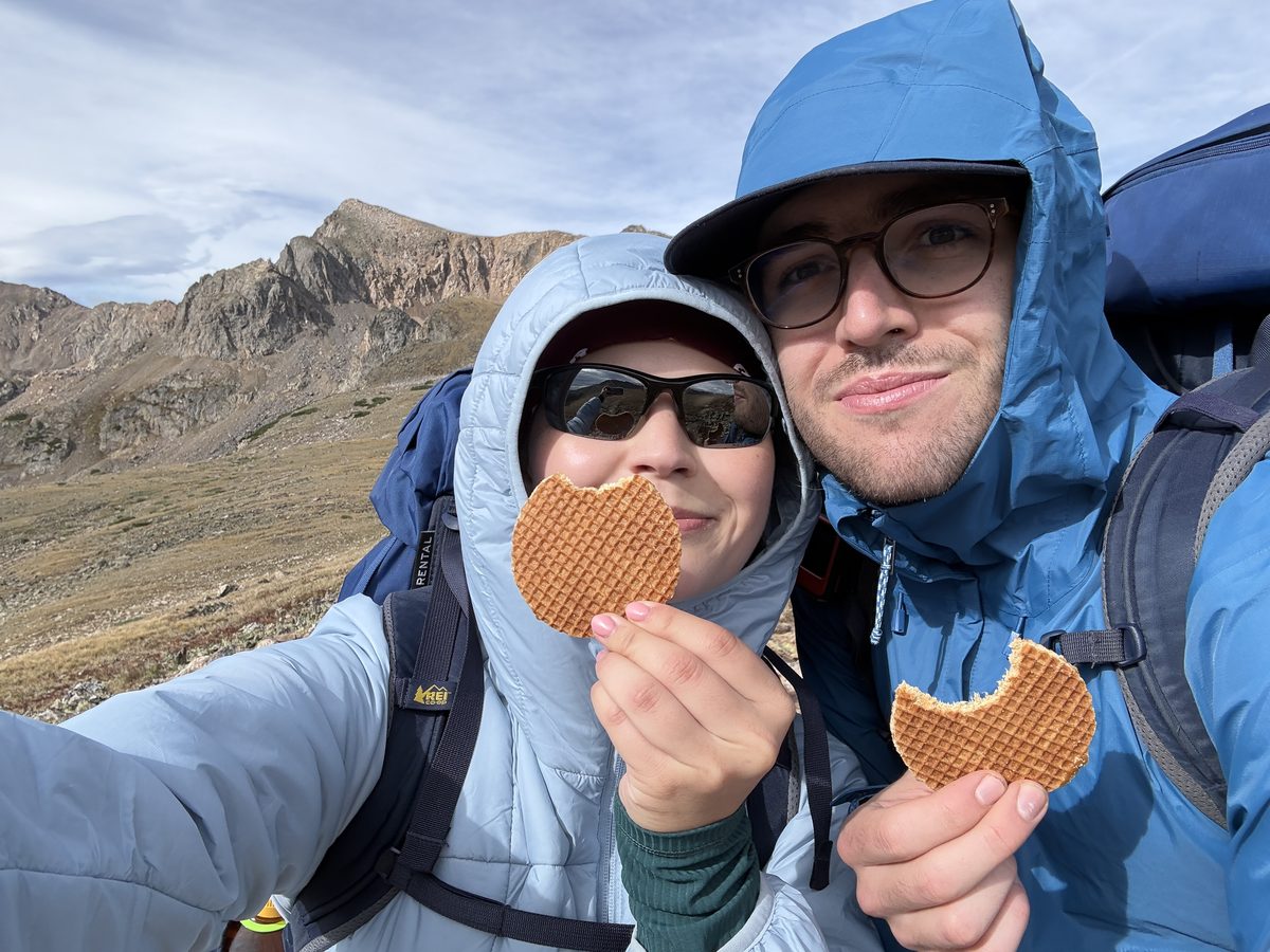Sharing a stroopwafel on a backpacking trip